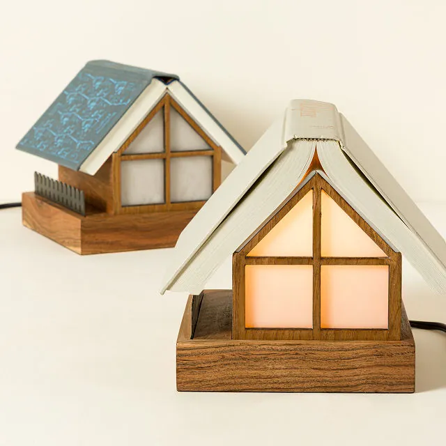 A reading lamp shaped like a house