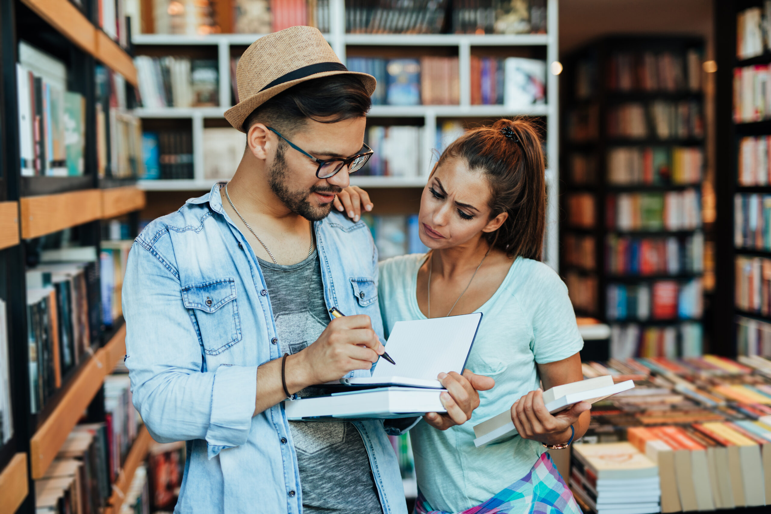 Two people looking at a book