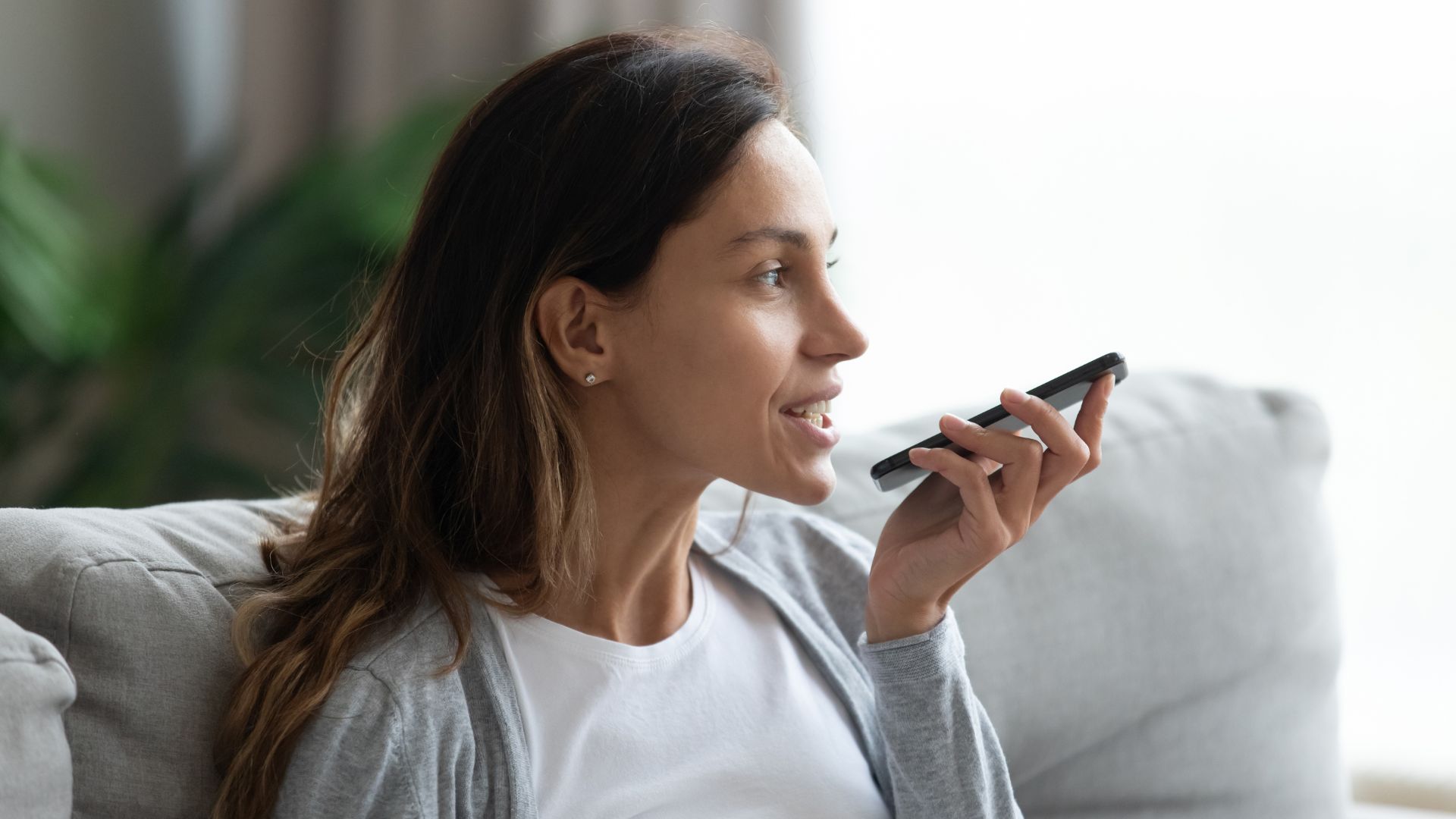 Woman using voice assist on her phone